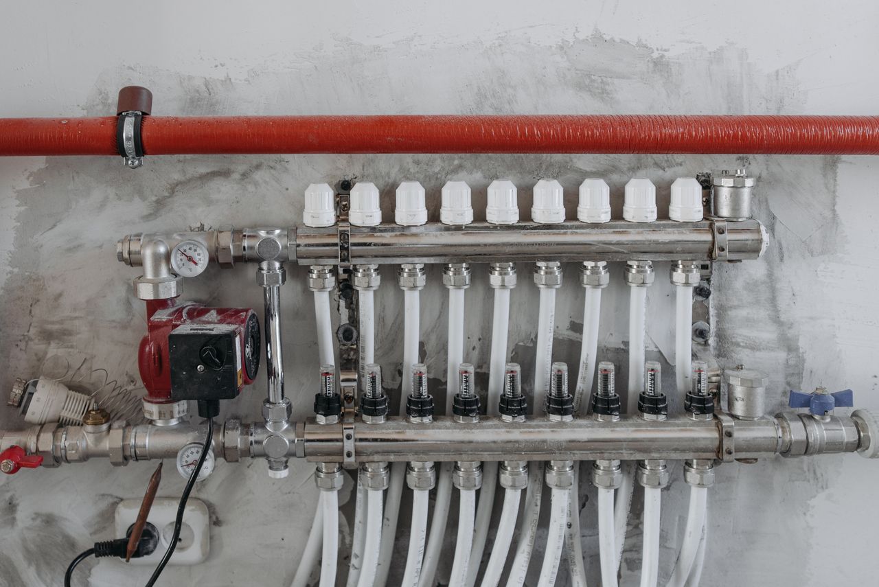 Crafting Captivating Headlines: Your awesome post title goes here A close-up view of an industrial manifold with pressure gauges and connected steel pipes.